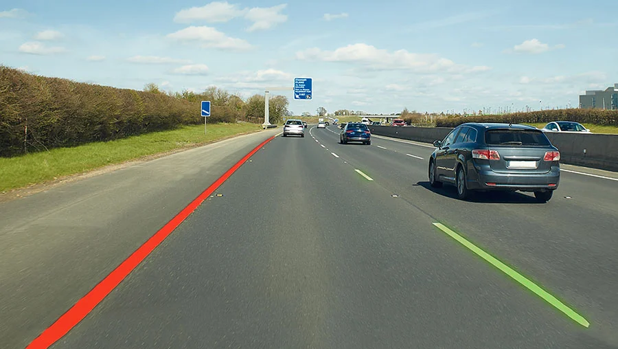 Photo of a road with areas highlighted for safety and danger.